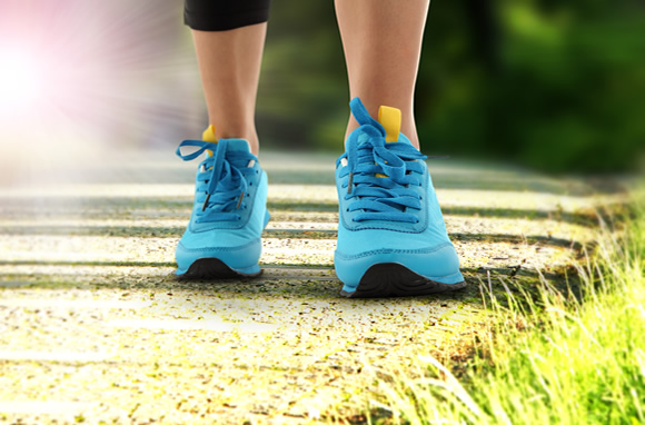 Lady Walking with Blue Running Shoes