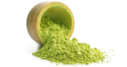 Matcha Green Tea powder in wooden bowl